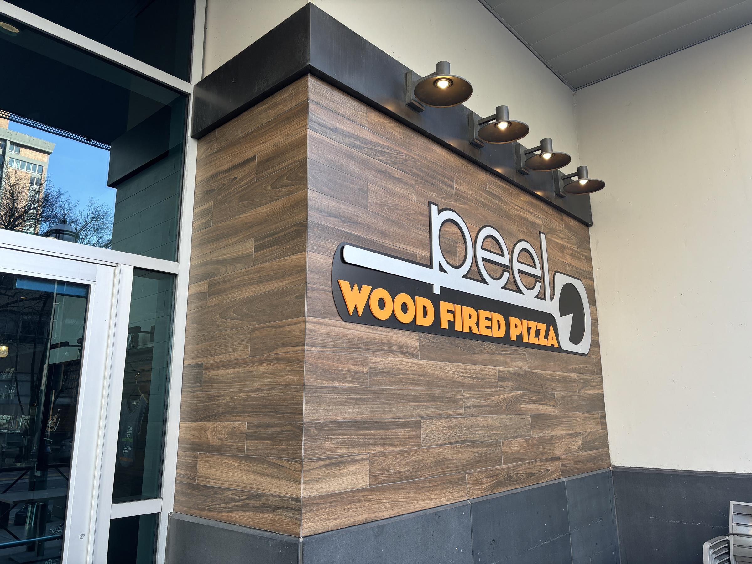 Peel Wood Fired Pizza signage